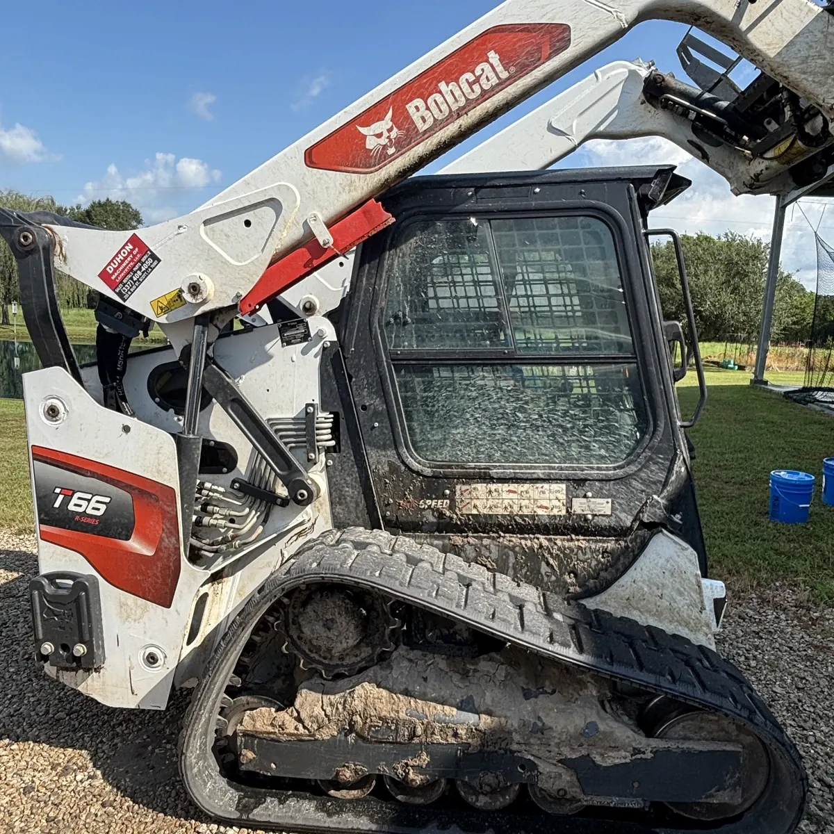 Bobcat skid steer cab before cleaning