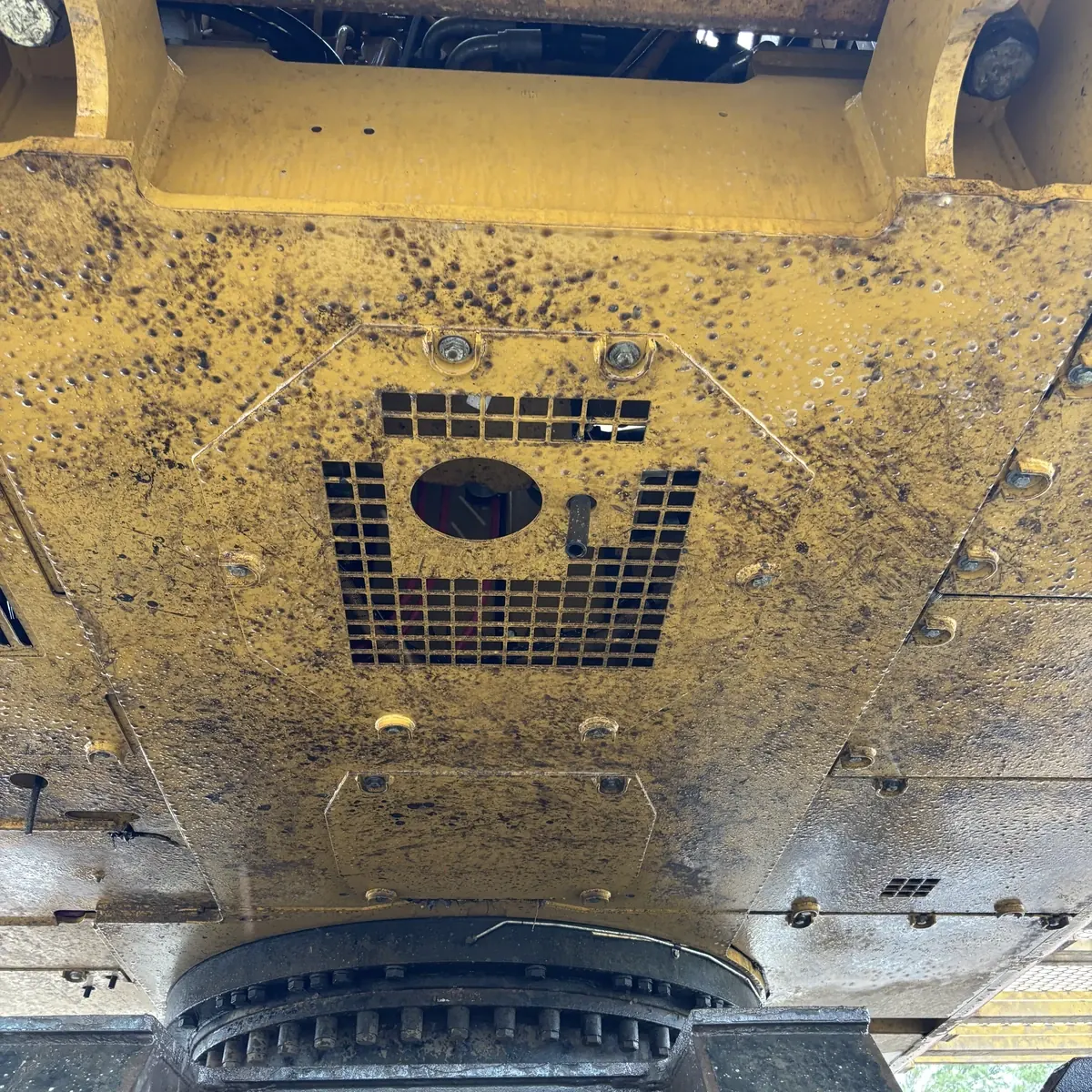 CAT equipment underside before cleaning